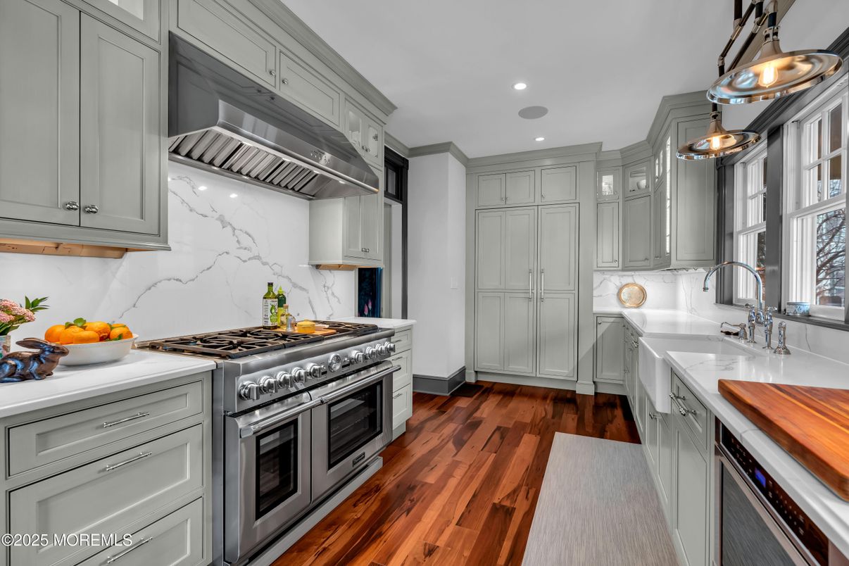 Interior, Kitchen, Marble Walls, Recessed Lighting, Stainless Steel Appliances, Wood Texture Flooring
