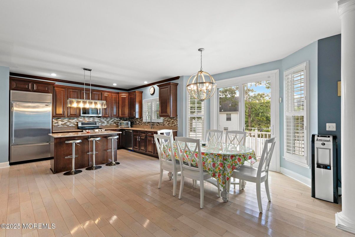 Dining room, Interior, Kitchen, Pendant Lights, Recessed Lighting, Stainless Steel Appliances, Wood Texture Flooring