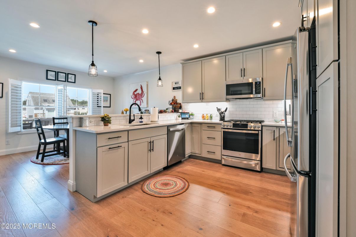 Dining room, Interior, Kitchen, Pendant Lights, Recessed Lighting, Stainless Steel Appliances, Wood Texture Flooring