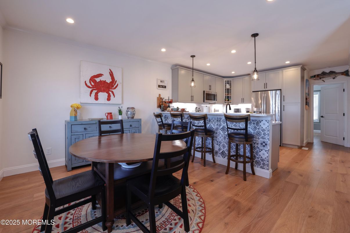 Dining room, Interior, Kitchen, Pendant Lights, Recessed Lighting, Stainless Steel Appliances, Wood Texture Flooring