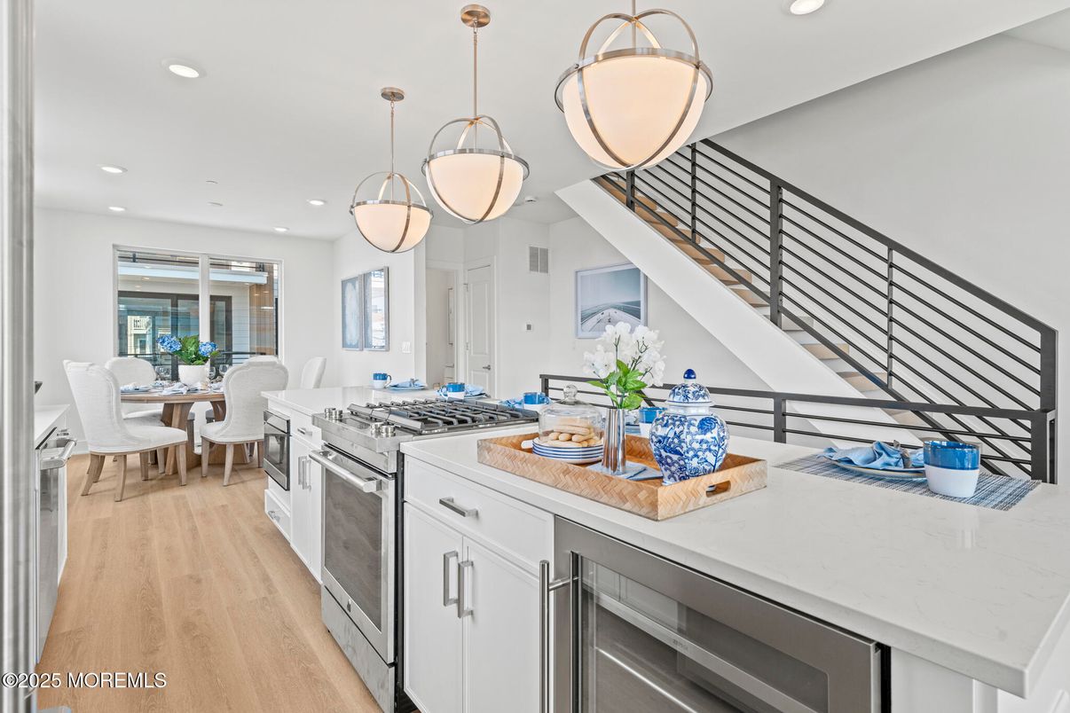 Dining room, Interior, Kitchen, Pendant Lights, Recessed Lighting, Stainless Steel Appliances, Wood Texture Flooring