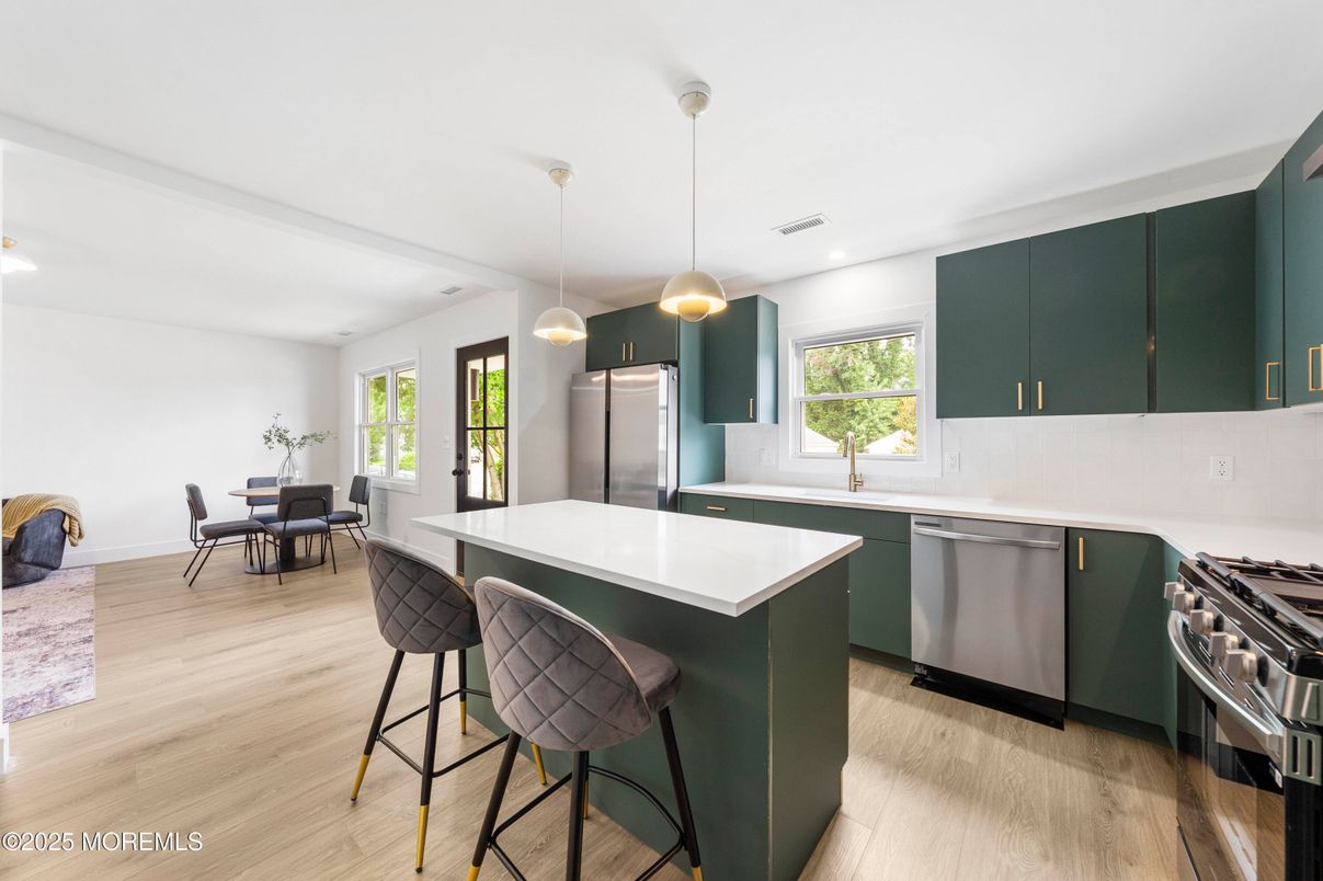 Dining room, Interior, Kitchen, Pendant Lights, Recessed Lighting, Stainless Steel Appliances, Wood Texture Flooring