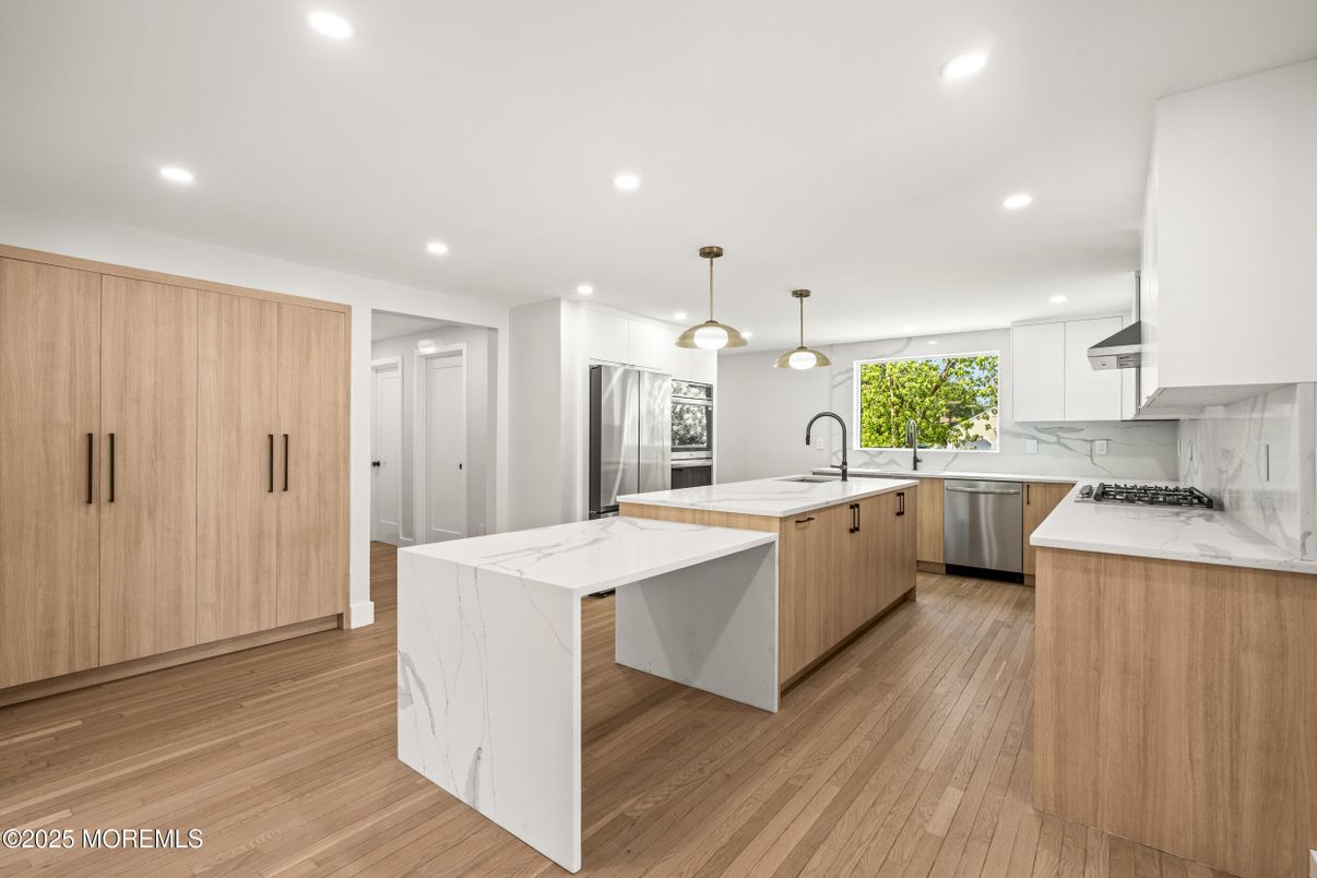 Interior, Kitchen, Marble Walls, Pendant Lights, Recessed Lighting, Stainless Steel Appliances, Wood Texture Flooring