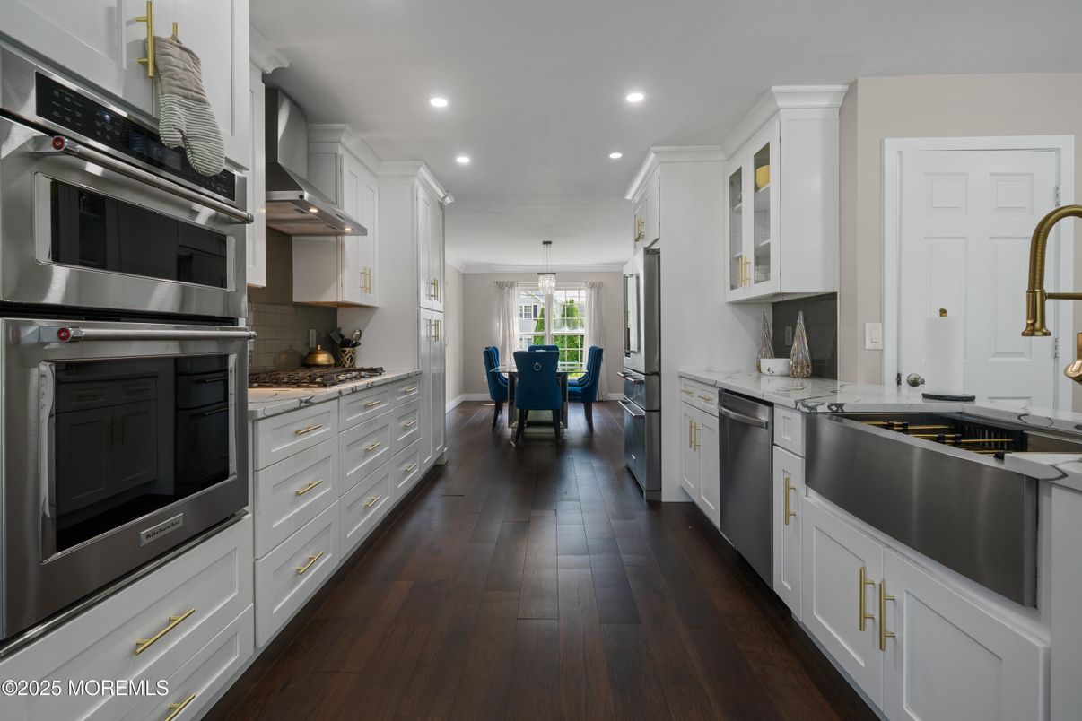 Dining room, Interior, Kitchen, Pendant Lights, Recessed Lighting, Stainless Steel Appliances, Wood Texture Flooring