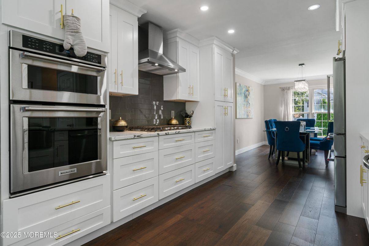 Chandelier, Dining room, Interior, Kitchen, Recessed Lighting, Stainless Steel Appliances, Wood Texture Flooring