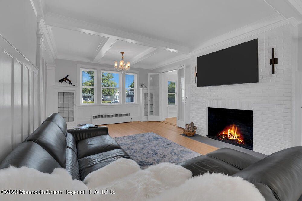 Chandelier, Fireplace, Interior, Living room, Stone Walls, Wood Texture Flooring
