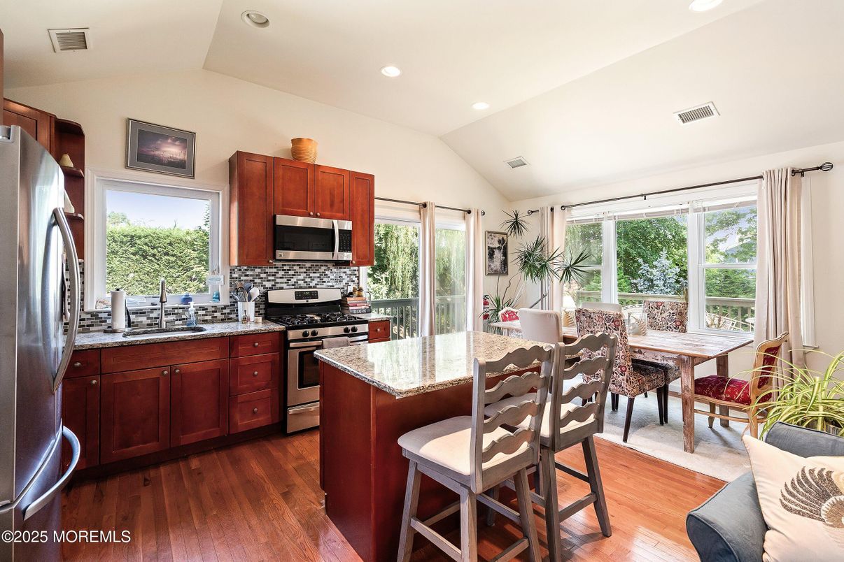 Dining room, Interior, Kitchen, Recessed Lighting, Stainless Steel Appliances, Wood Texture Flooring