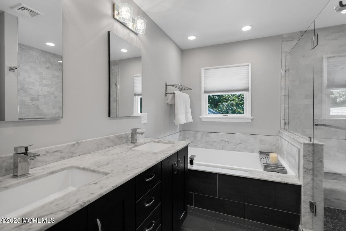 Bathroom, Dual Sink Vanities, Glass Shower, Interior, Marble Walls, Recessed Lighting