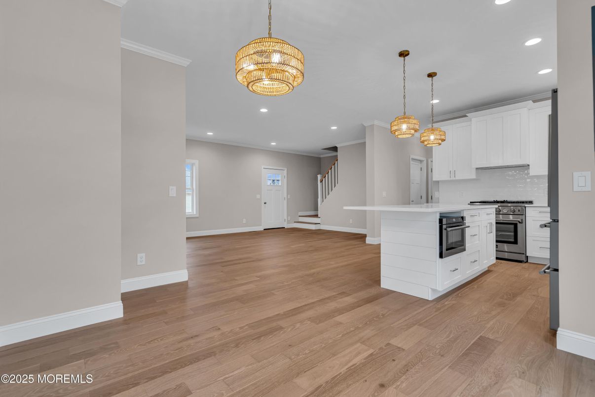 Chandelier, Interior, Kitchen, Pendant Lights, Recessed Lighting, Stainless Steel Appliances, Wood Texture Flooring