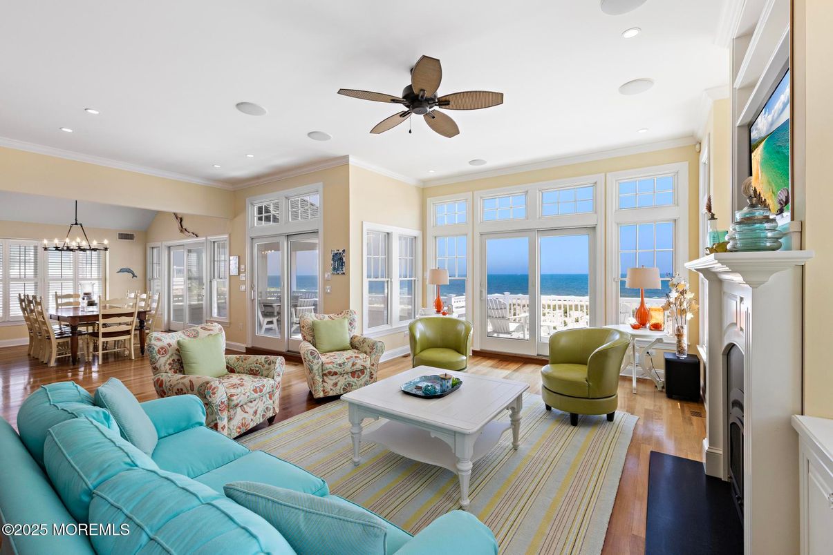 Chandelier, Dining room, Fireplace, Interior, Living room, Recessed Lighting, Water, Wood Texture Flooring