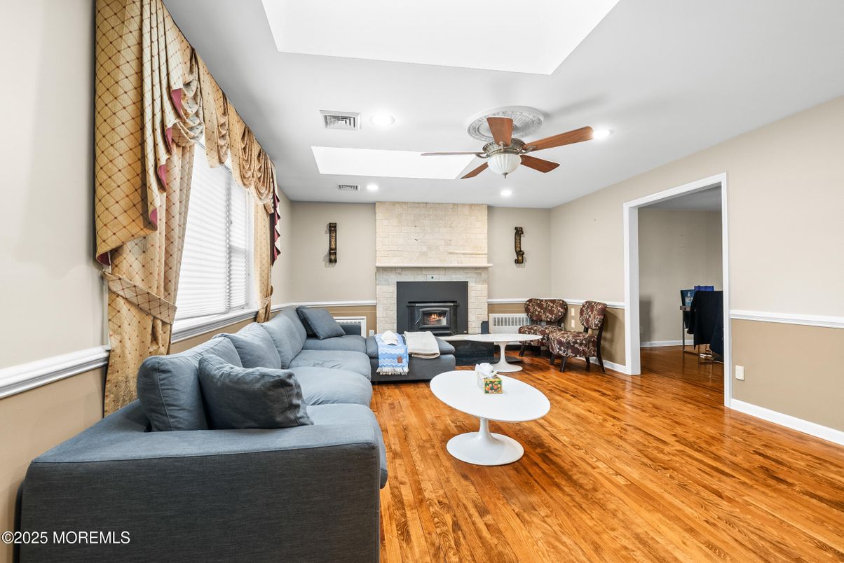 Fireplace, Interior, Living room, Recessed Lighting, Stone Walls, Wood Texture Flooring
