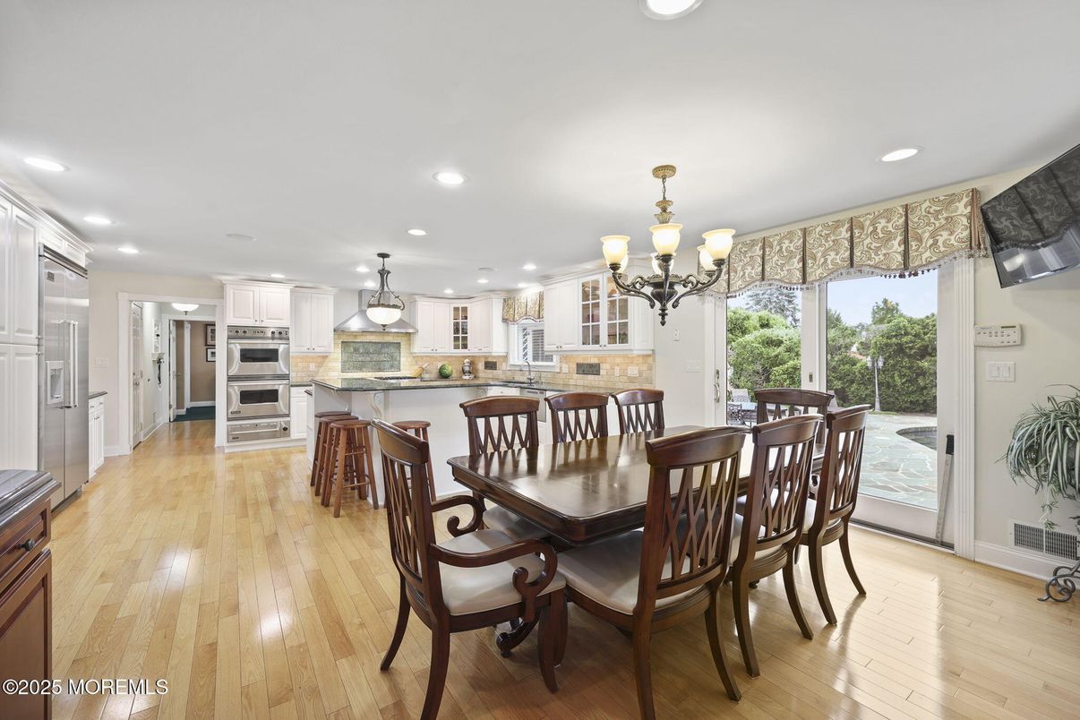 Chandelier, Dining room, Interior, Kitchen, Recessed Lighting, Stainless Steel Appliances, Wood Texture Flooring