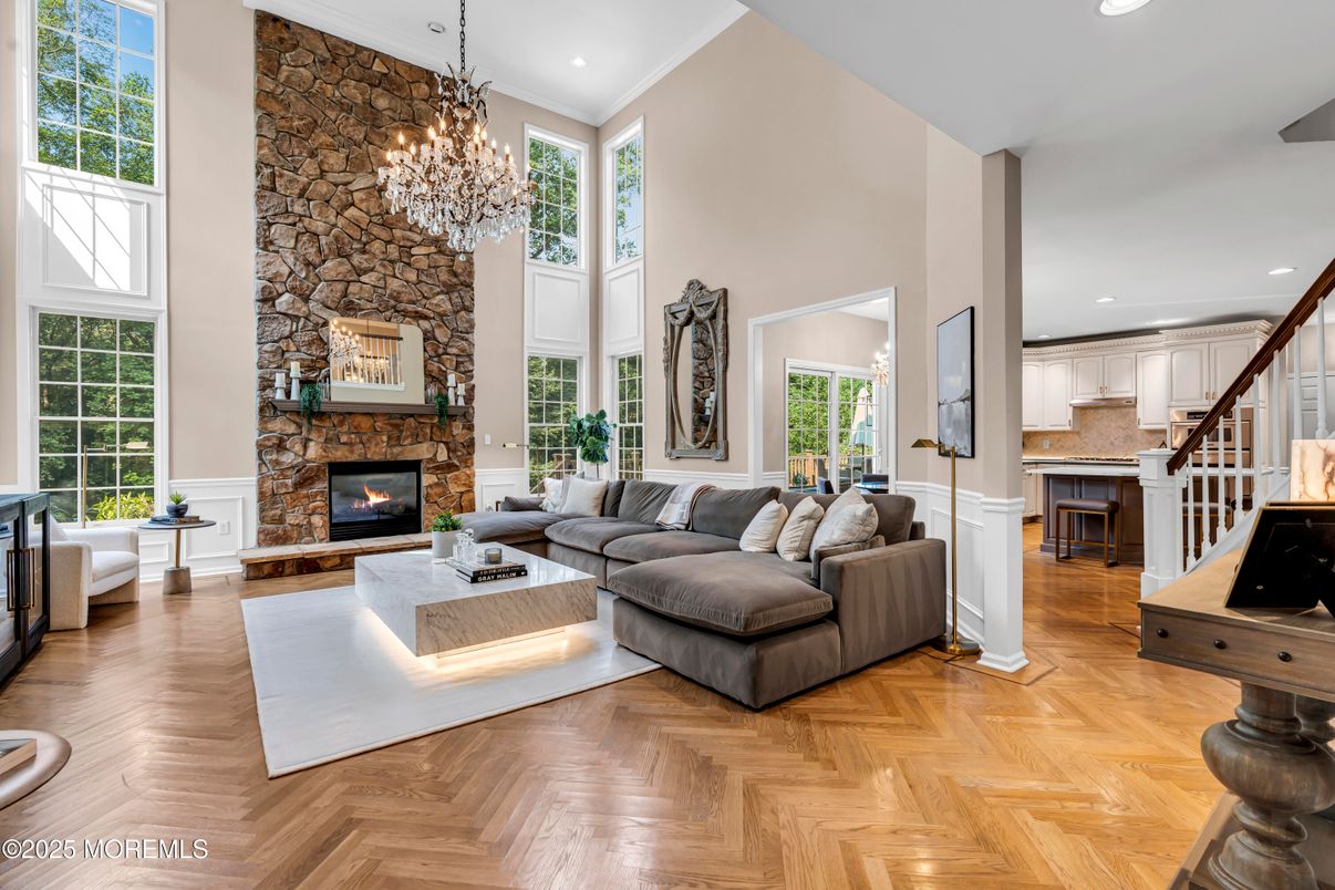 Chandelier, Fireplace, Interior, Kitchen, Living room, Recessed Lighting, Stone Walls, Wood Texture Flooring