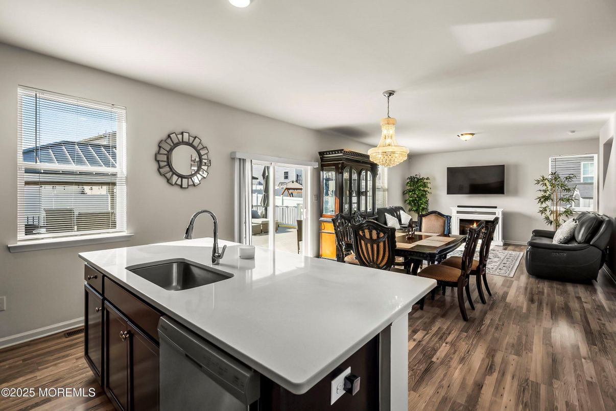 Chandelier, Dining room, Fireplace, Interior, Kitchen, Living room, Recessed Lighting, Wood Texture Flooring