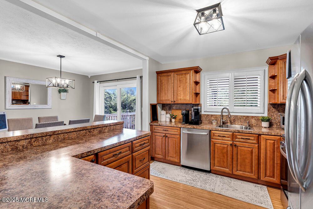 Dining room, Interior, Kitchen, Pendant Lights, Stainless Steel Appliances, Wood Texture Flooring