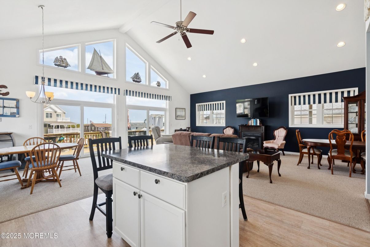 Chandelier, Dining room, Fireplace, Interior, Living room, Recessed Lighting, Wood Texture Flooring
