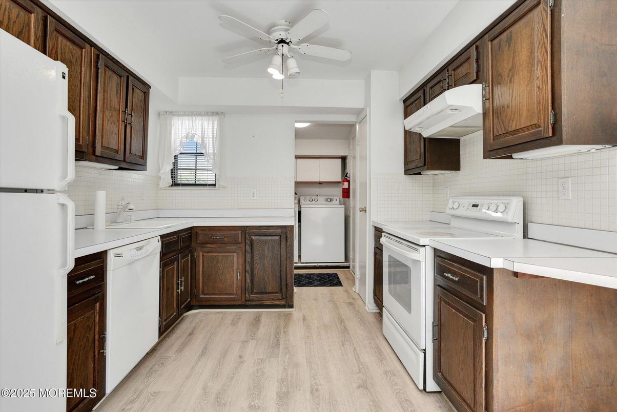 Interior, Kitchen, Recessed Lighting, Tile Countertops, Wood Texture Flooring