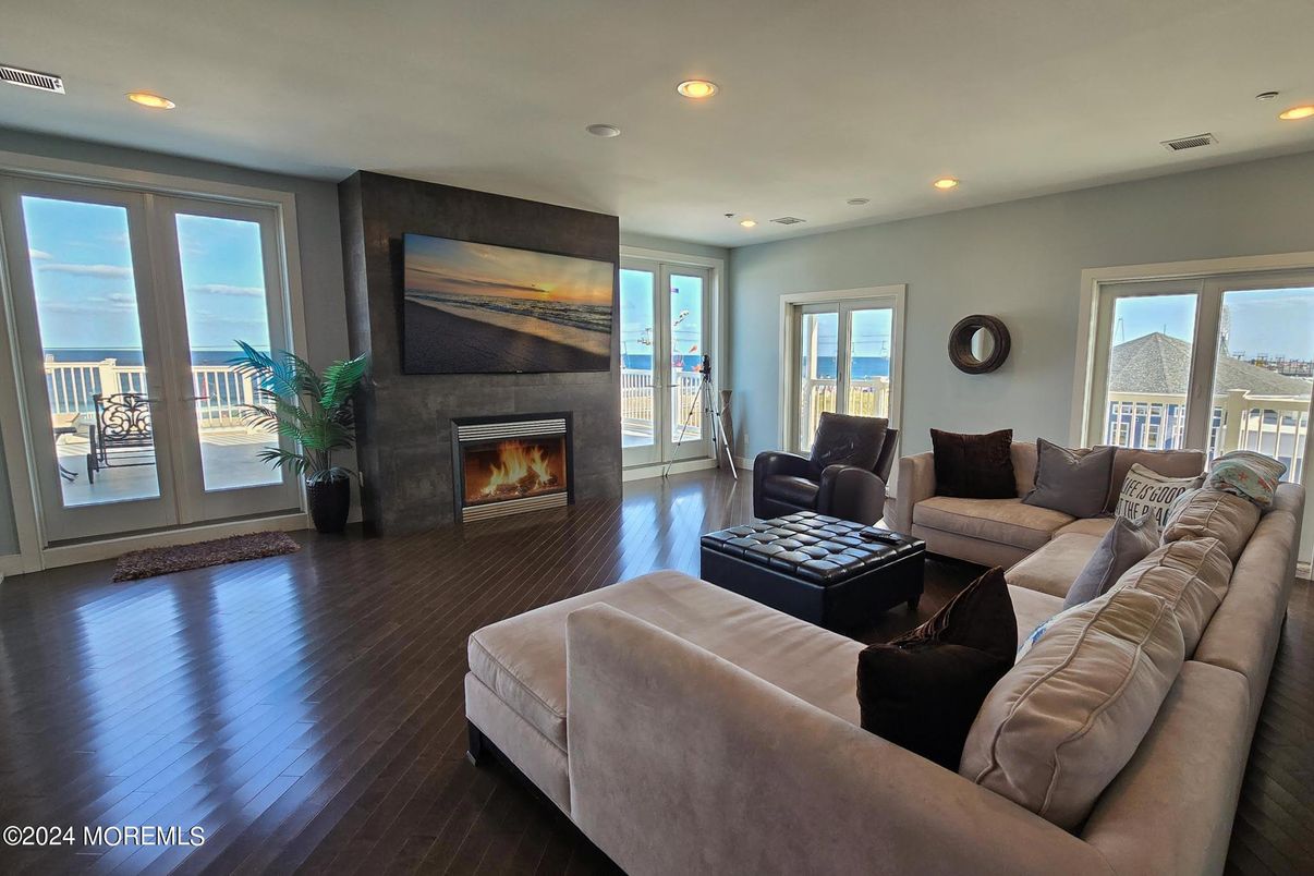 Fireplace, Interior, Living room, Recessed Lighting, Water, Wood Texture Flooring