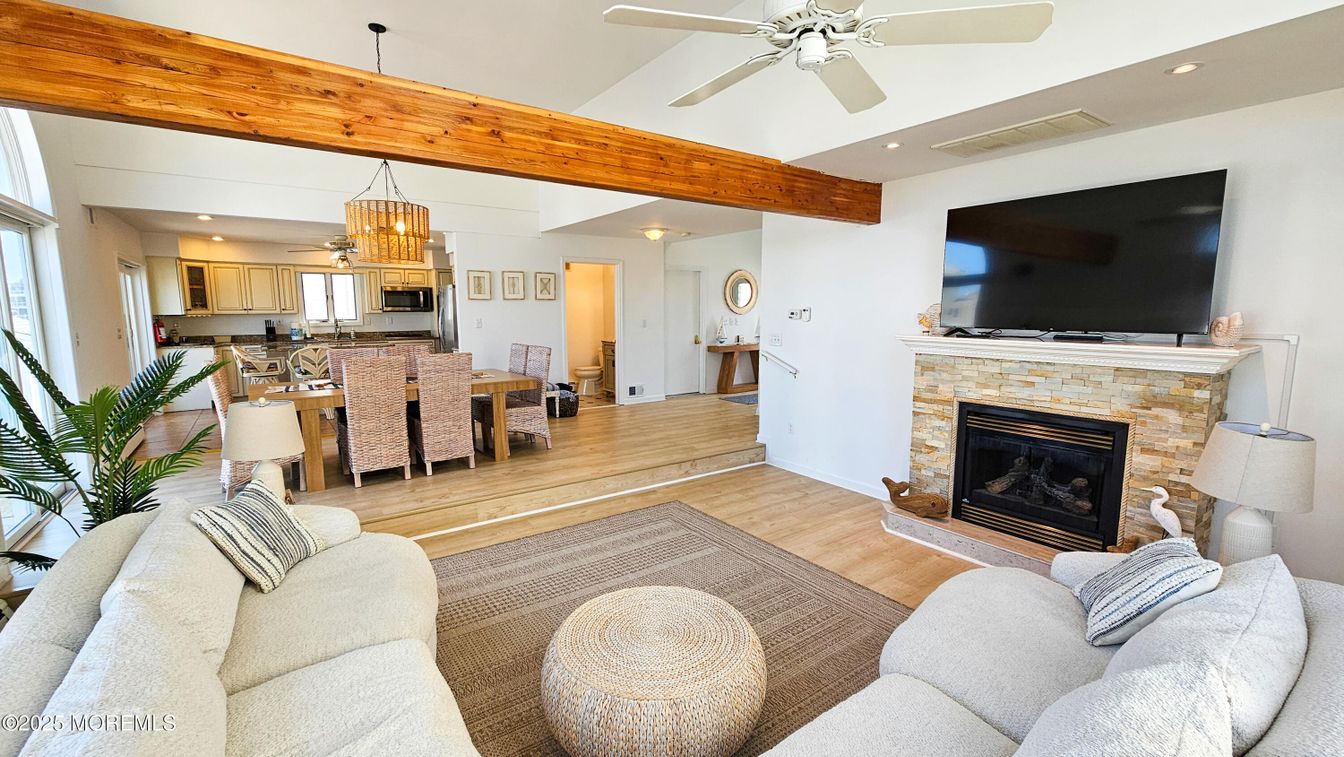 Chandelier, Dining room, Fireplace, Interior, Kitchen, Living room, Pendant Lights, Recessed Lighting, Stainless Steel Appliances, Wooden Beams, Wood Texture Flooring