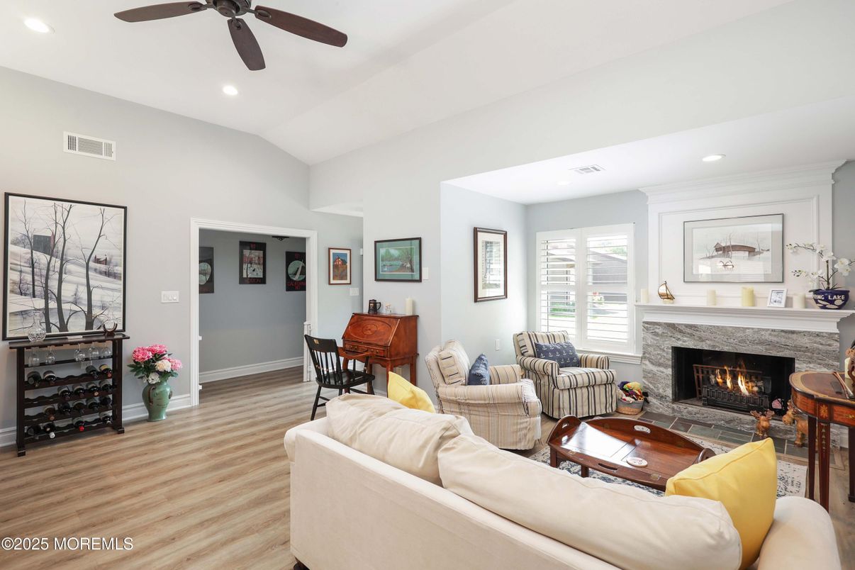 Dining room, Fireplace, Interior, Living room, Recessed Lighting, Wood Texture Flooring