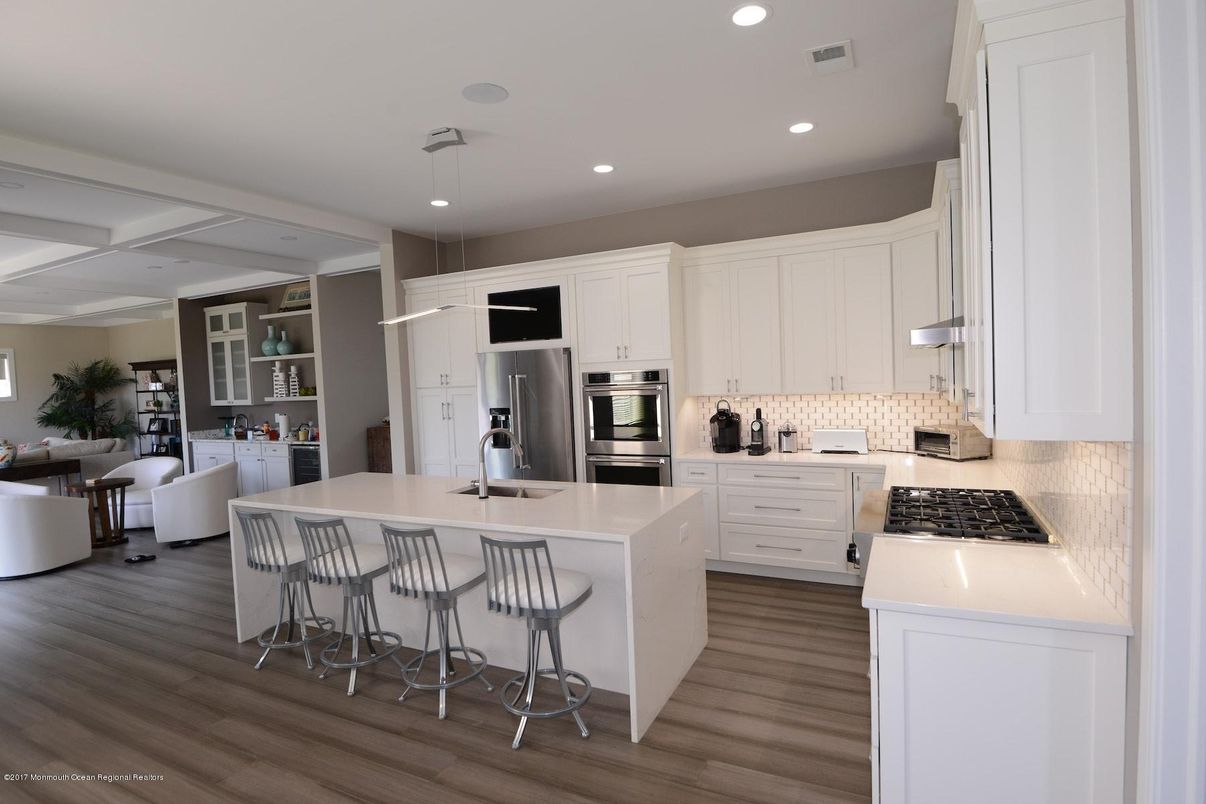 Dining room, Interior, Kitchen, Recessed Lighting, Stainless Steel Appliances, Wood Texture Flooring