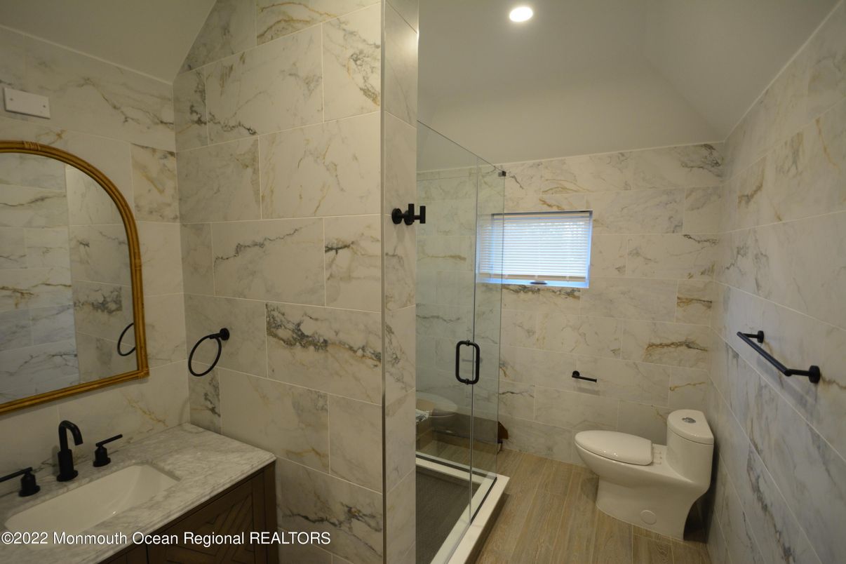 Bathroom, Glass Shower, Interior, Marble Walls, Recessed Lighting, Wood Texture Flooring