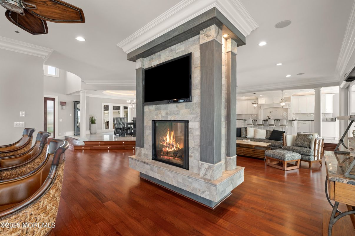 Fireplace, Interior, Living room, Pendant Lights, Recessed Lighting, Stone Walls, Wood Texture Flooring