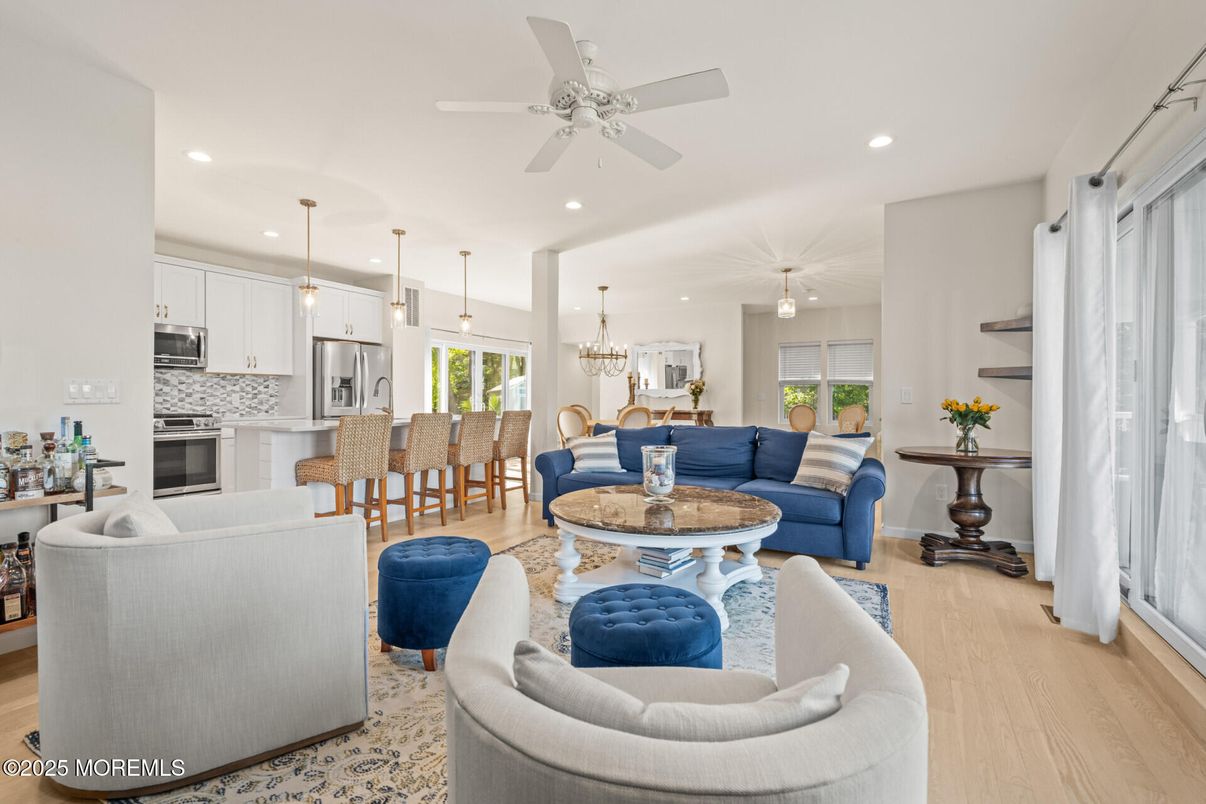 Chandelier, Dining room, Interior, Kitchen, Living room, Pendant Lights, Recessed Lighting, Stainless Steel Appliances, Wood Texture Flooring
