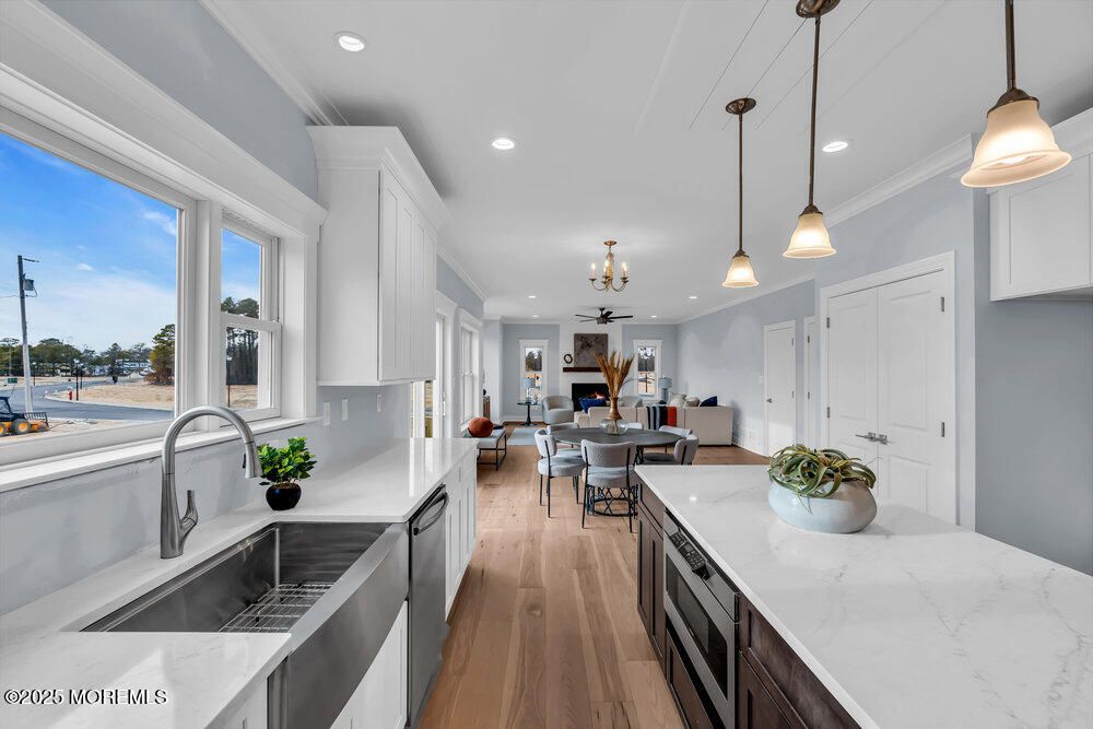 Dining room, Interior, Kitchen, Pendant Lights, Recessed Lighting, Stainless Steel Appliances, Wood Texture Flooring