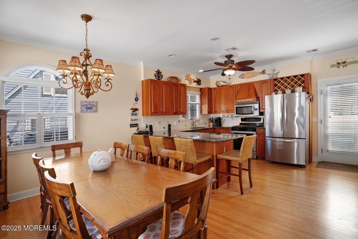 Chandelier, Dining room, Interior, Kitchen, Recessed Lighting, Stainless Steel Appliances, Wood Texture Flooring