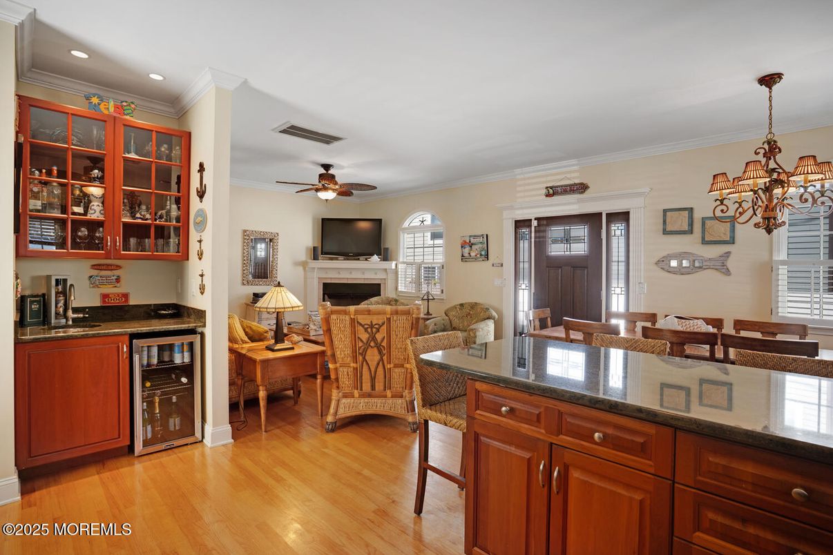 Chandelier, Dining room, Fireplace, Interior, Living room, Recessed Lighting, Wood Texture Flooring