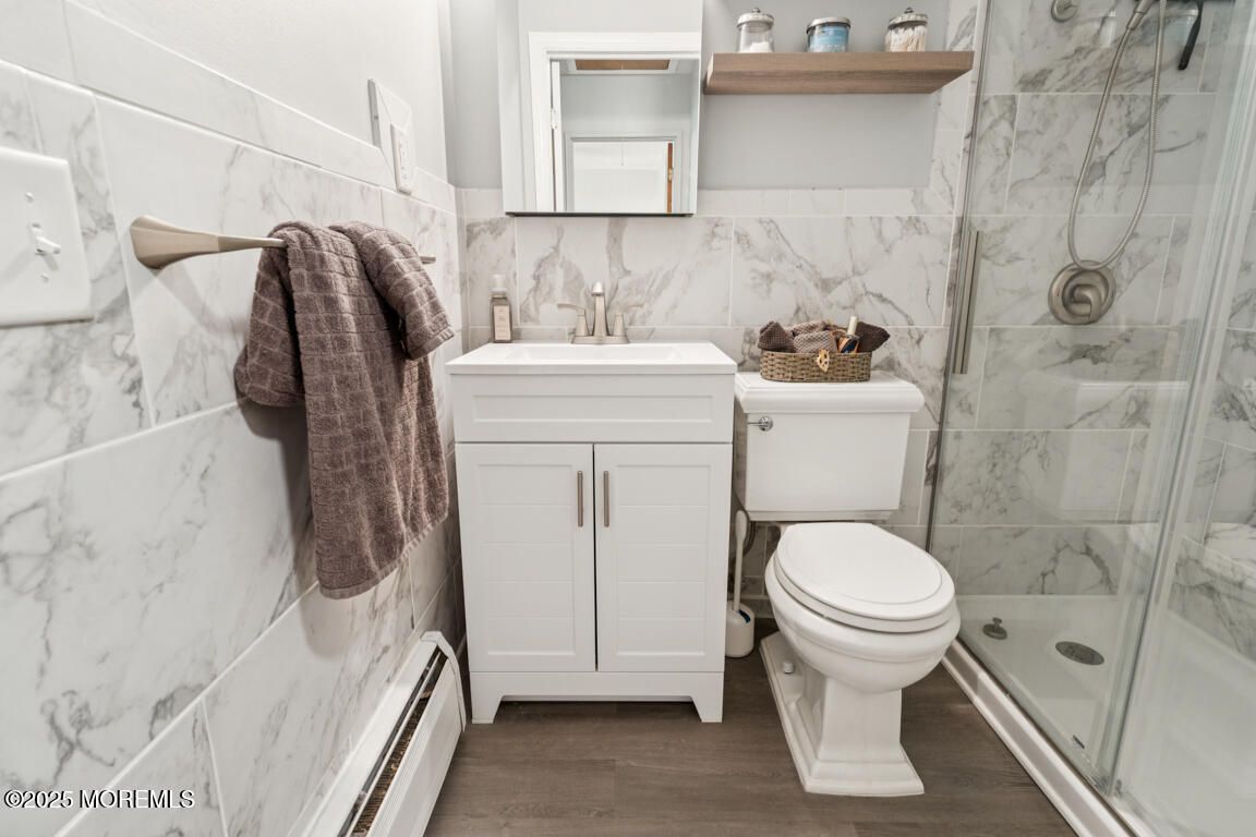 Bathroom, Glass Shower, Interior, Marble Walls, Wood Texture Flooring