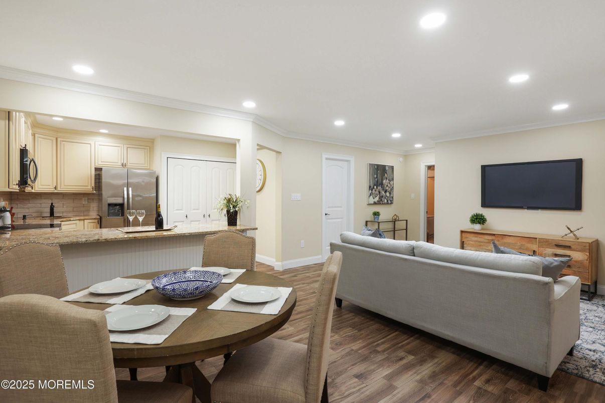 Dining room, Interior, Kitchen, Living room, Recessed Lighting, Stainless Steel Appliances, Wood Texture Flooring