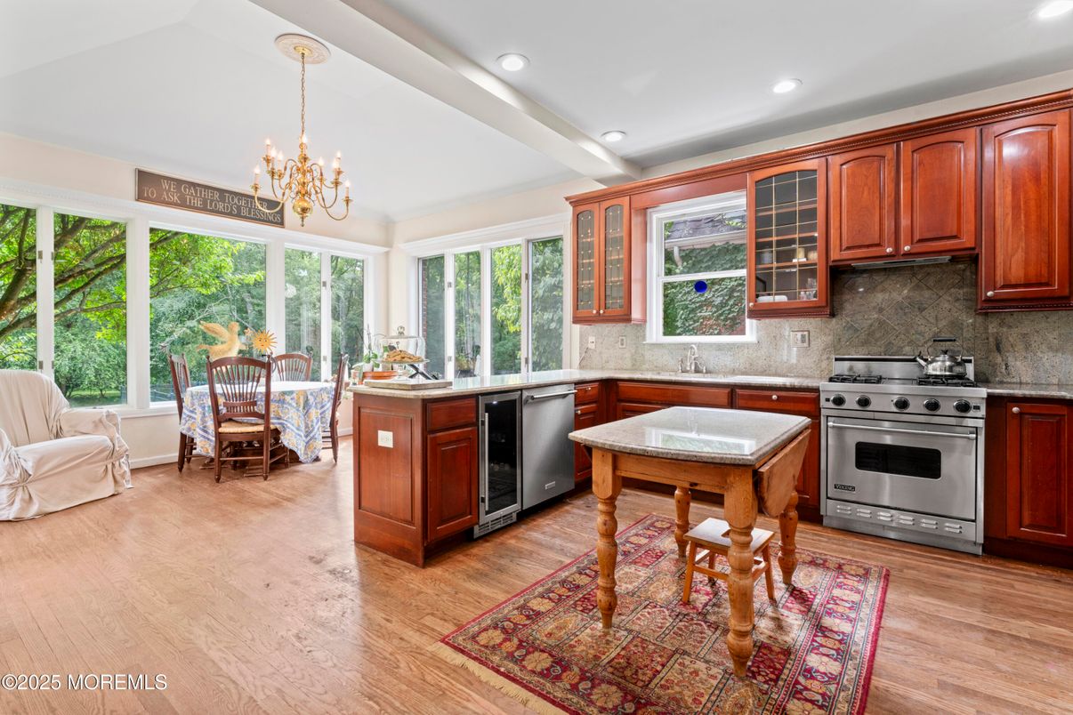Chandelier, Dining room, Interior, Kitchen, Recessed Lighting, Stainless Steel Appliances, Wood Texture Flooring