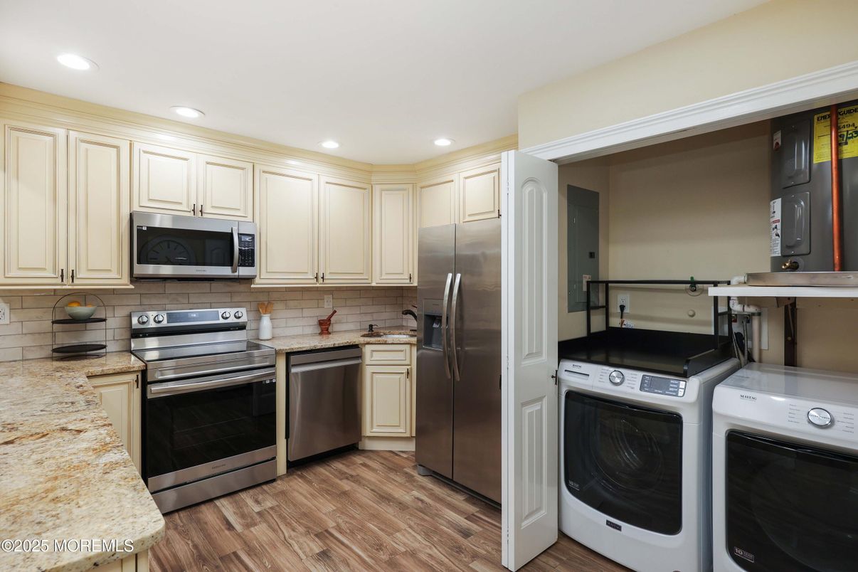 Interior, Kitchen, Recessed Lighting, Stainless Steel Appliances, Washer, Wood Texture Flooring