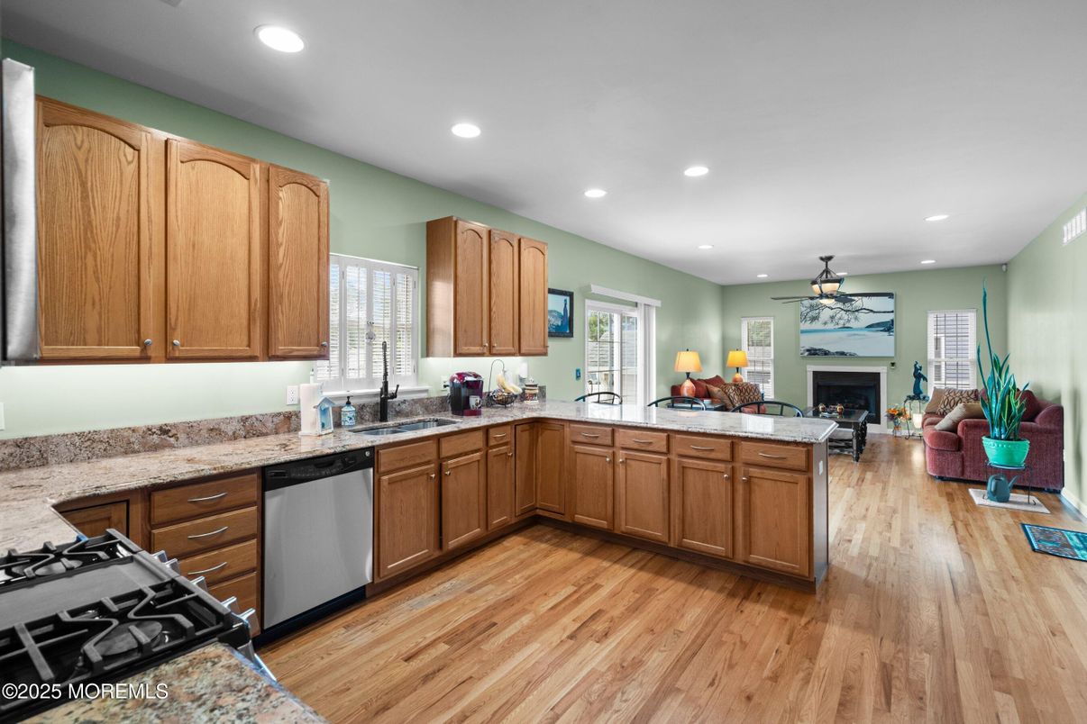 Fireplace, Interior, Kitchen, Living room, Recessed Lighting, Wood Texture Flooring