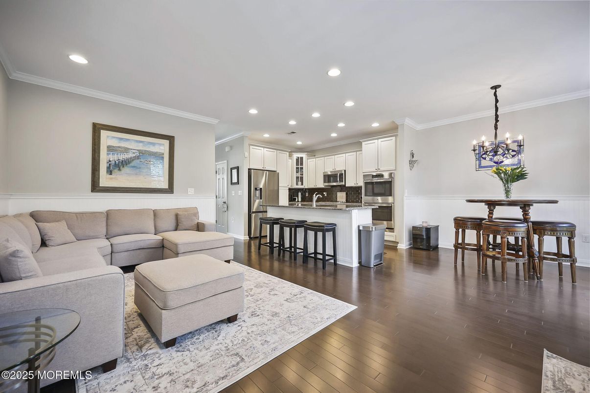 Chandelier, Interior, Kitchen, Living room, Pendant Lights, Recessed Lighting, Stainless Steel Appliances, Wood Texture Flooring