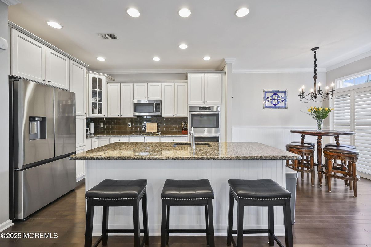 Chandelier, Dining room, Interior, Kitchen, Recessed Lighting, Stainless Steel Appliances, Wood Texture Flooring