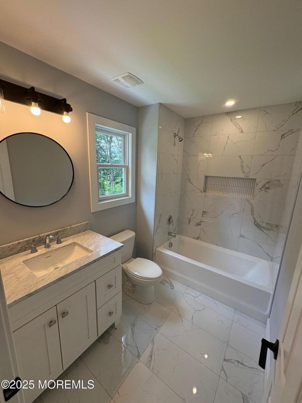 Bathroom, Dual Sink Vanities, Interior, Marble, Marble Walls, Recessed Lighting