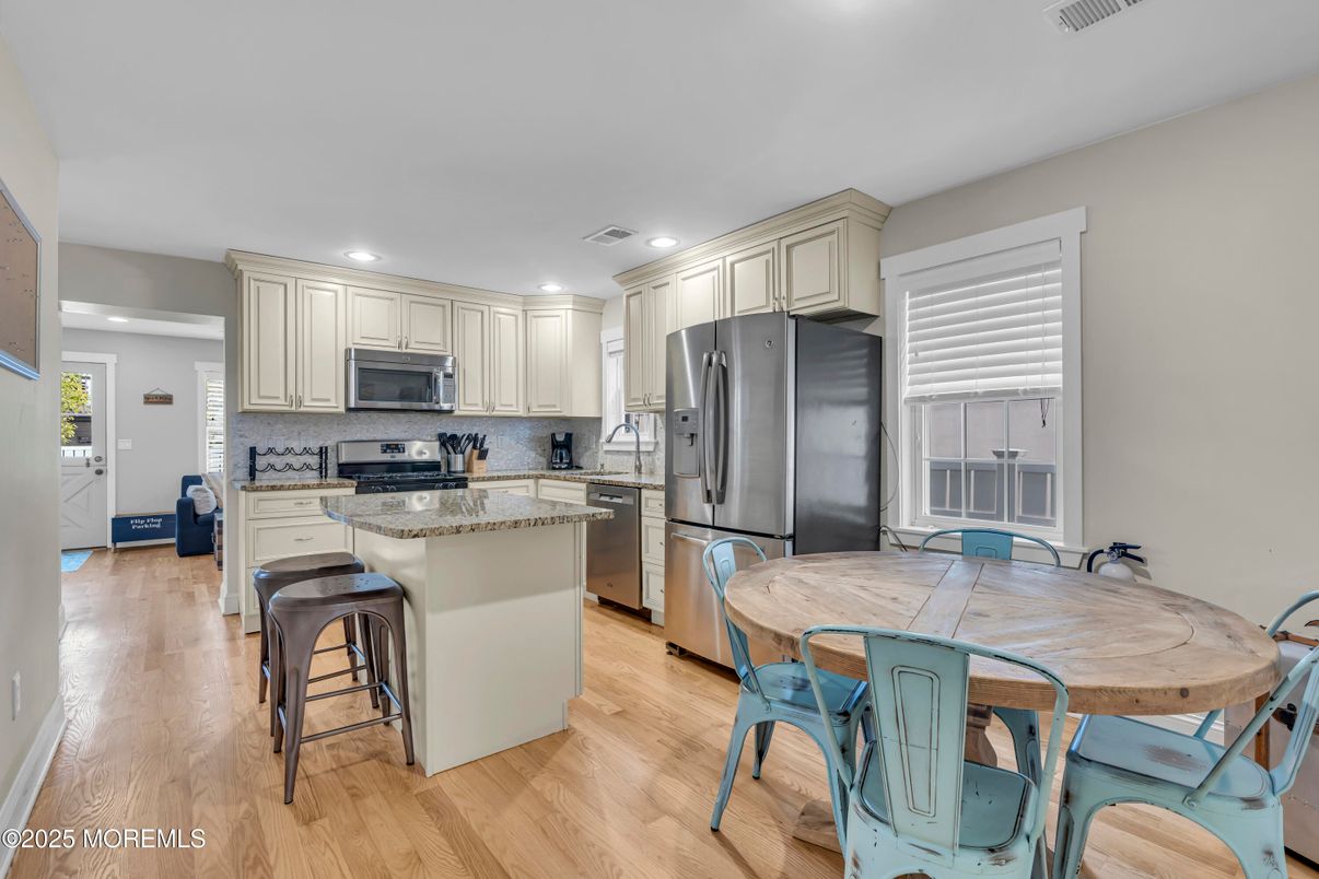 Dining room, Interior, Kitchen, Recessed Lighting, Stainless Steel Appliances, Wood Texture Flooring