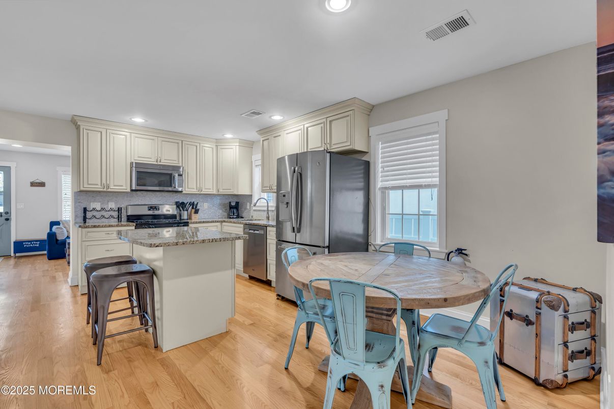 Dining room, Interior, Kitchen, Recessed Lighting, Stainless Steel Appliances, Wood Texture Flooring