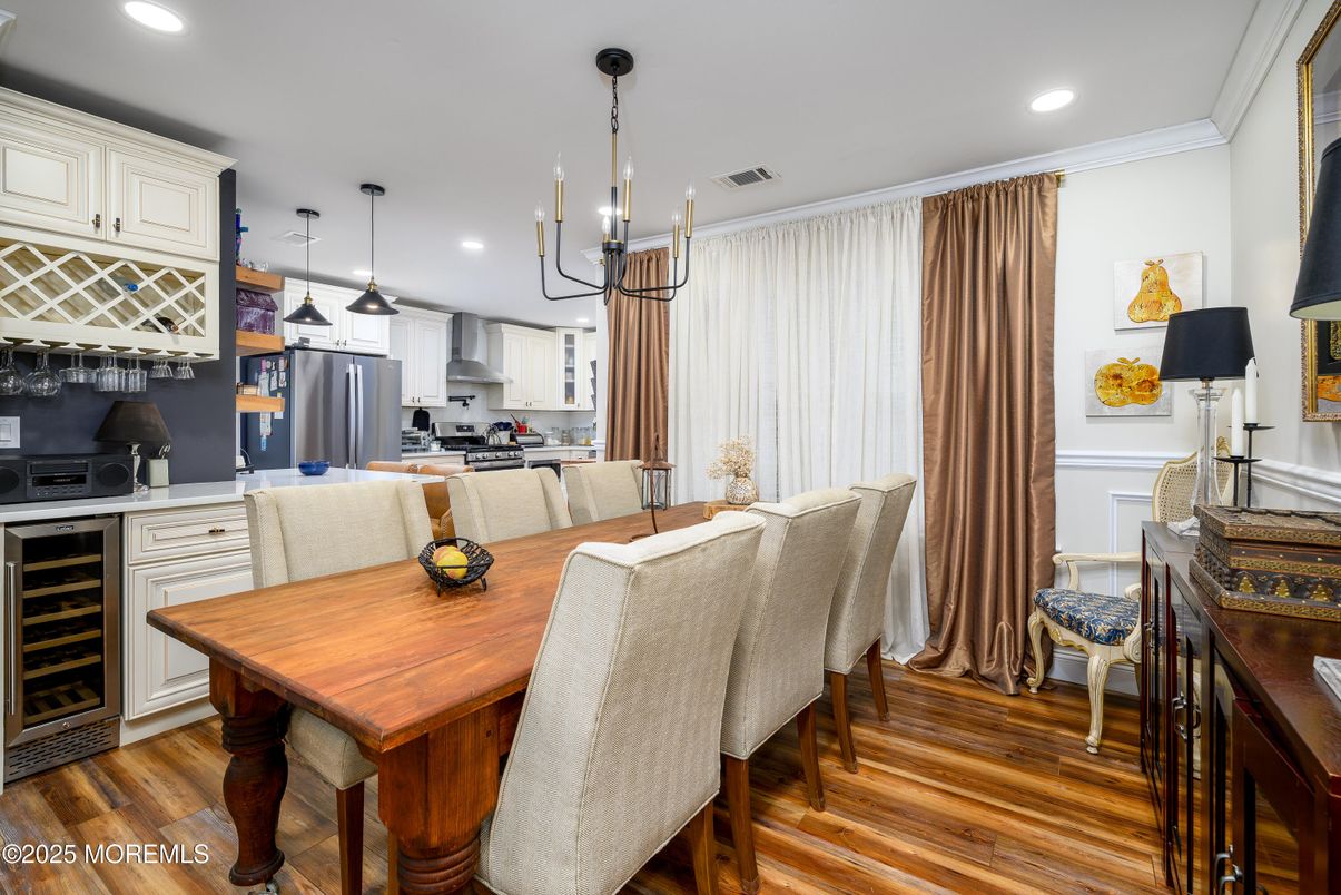 Dining room, Interior, Kitchen, Pendant Lights, Recessed Lighting, Stainless Steel Appliances, Wood Texture Flooring