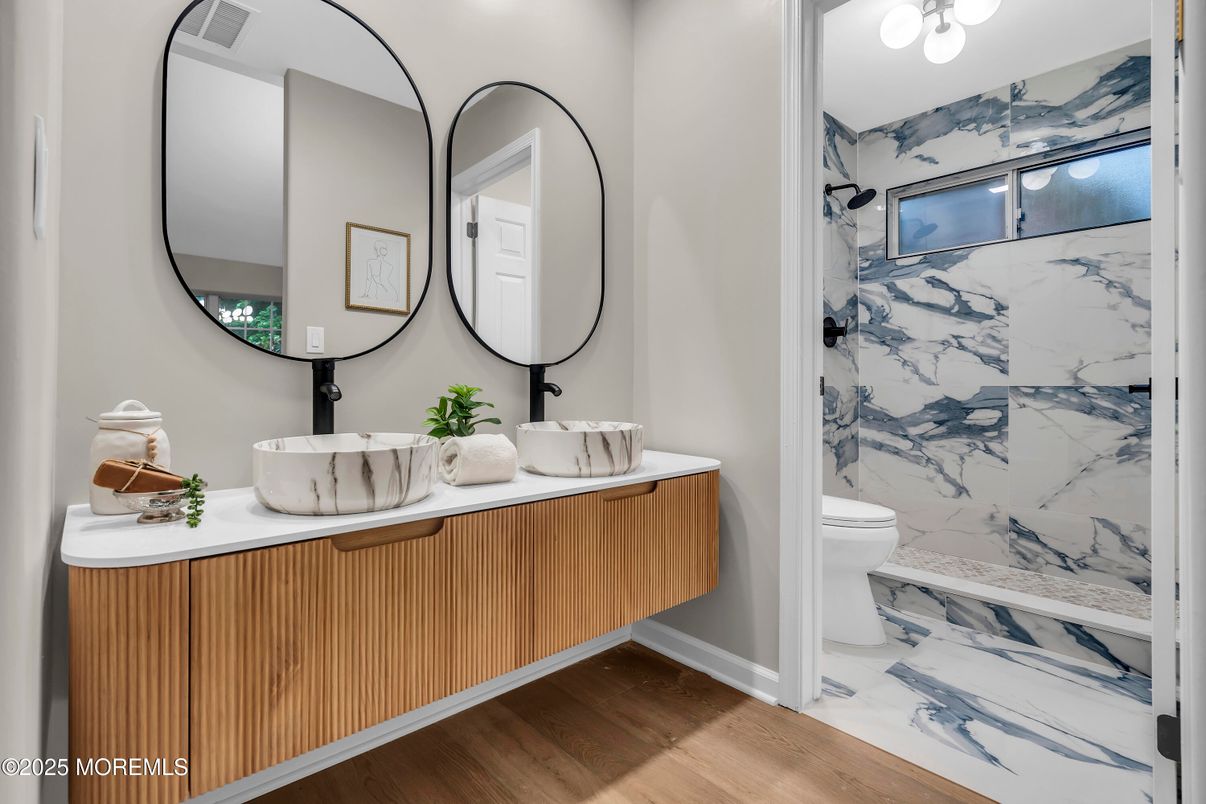 Bathroom, Dual Sink Vanities, Interior, Marble Walls, Wood Texture Flooring