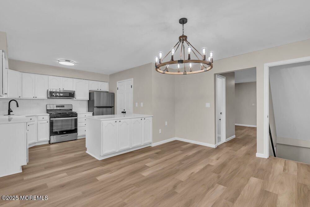 Chandelier, Interior, Kitchen, Pendant Lights, Stainless Steel Appliances, Wood Texture Flooring