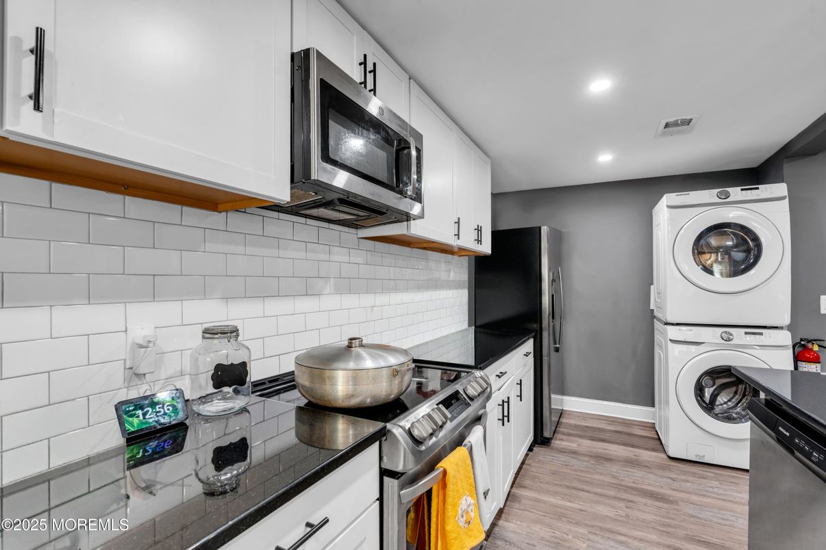 Interior, Kitchen, Recessed Lighting, Washer, Wood Texture Flooring