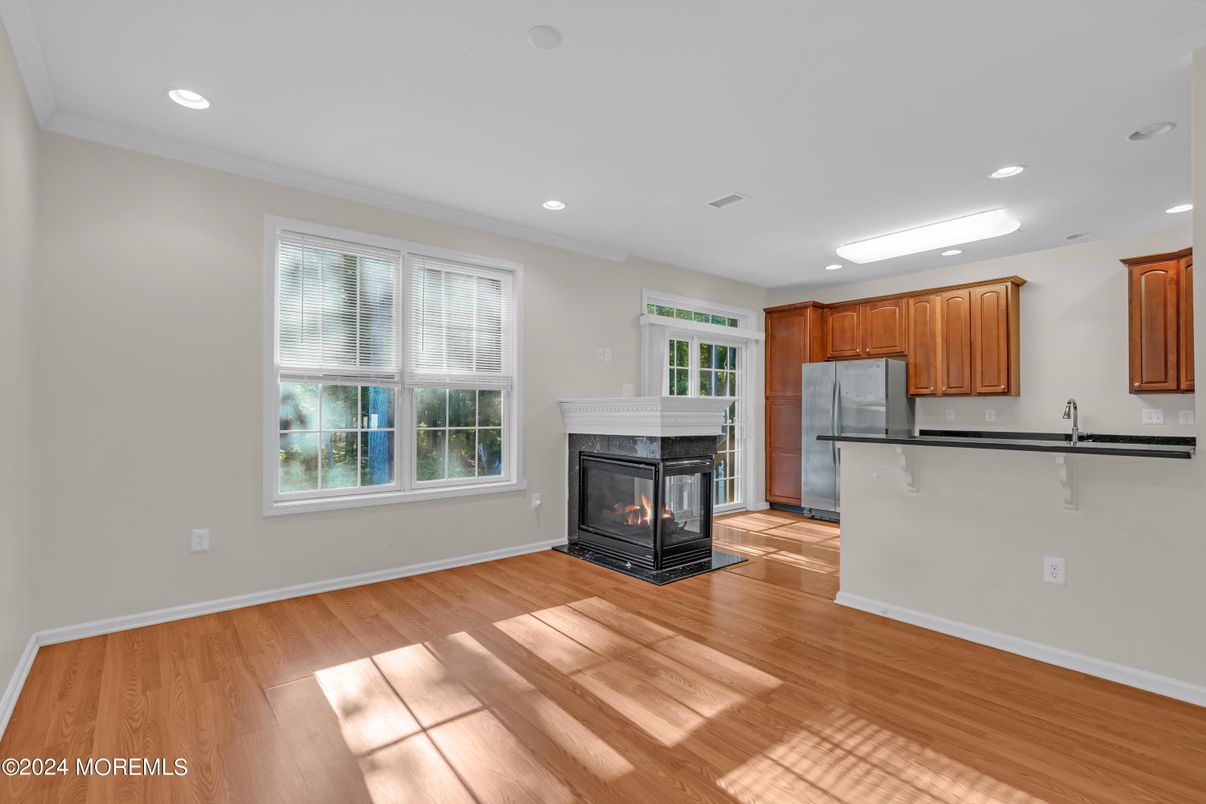 Empty room, Fireplace, Interior, Kitchen, Recessed Lighting, Wood Texture Flooring