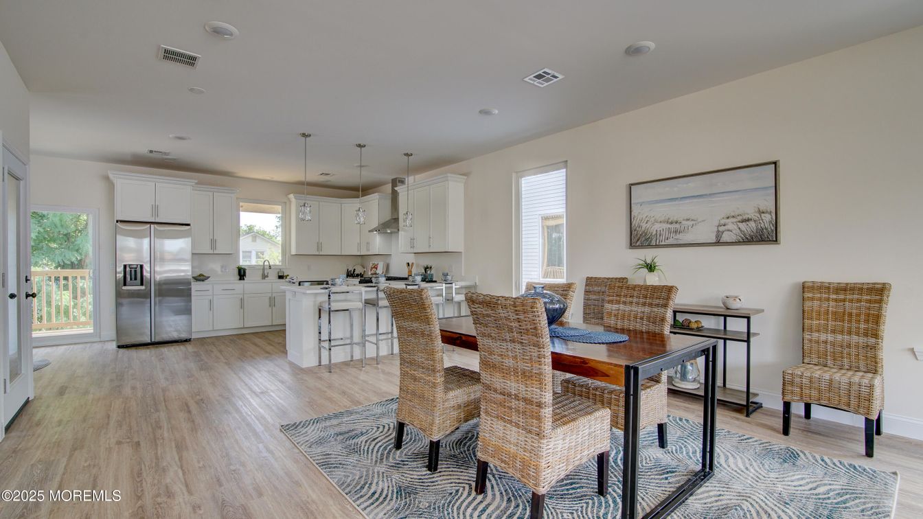 Dining room, Interior, Kitchen, Pendant Lights, Recessed Lighting, Stainless Steel Appliances, Wood Texture Flooring