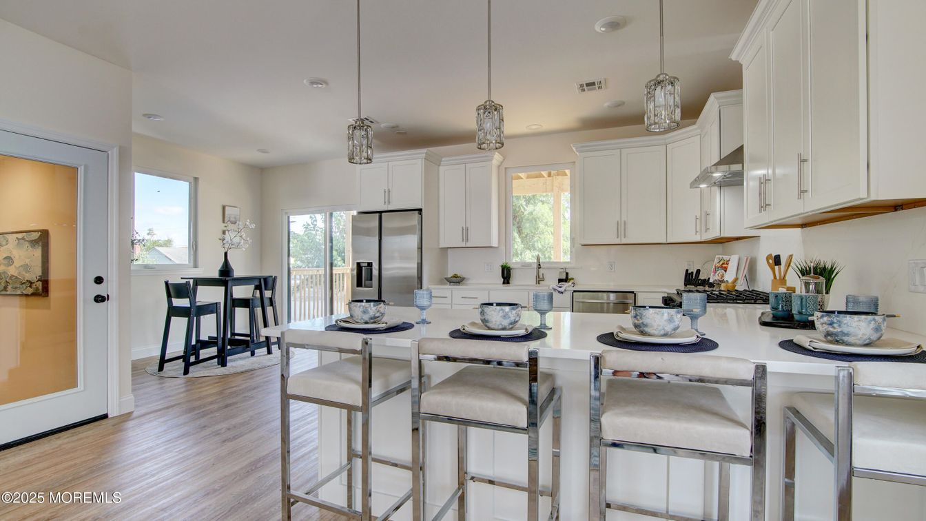 Dining room, Interior, Kitchen, Pendant Lights, Recessed Lighting, Stainless Steel Appliances, Wood Texture Flooring