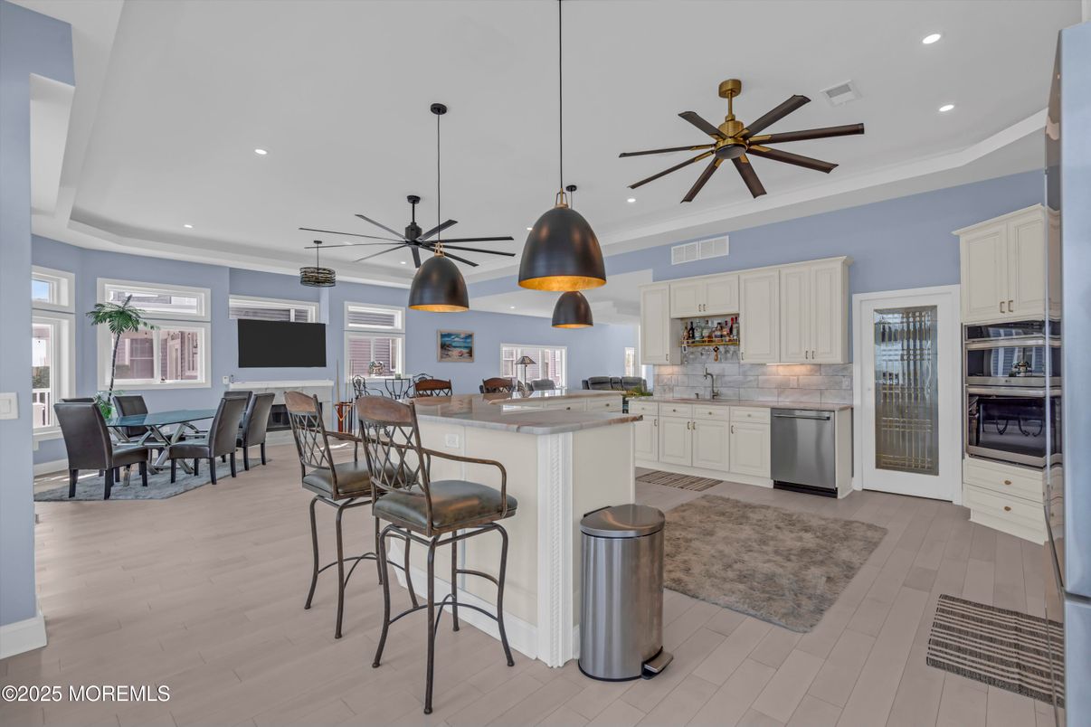 Dining room, Interior, Kitchen, Pendant Lights, Recessed Lighting, Stainless Steel Appliances, Wood Texture Flooring