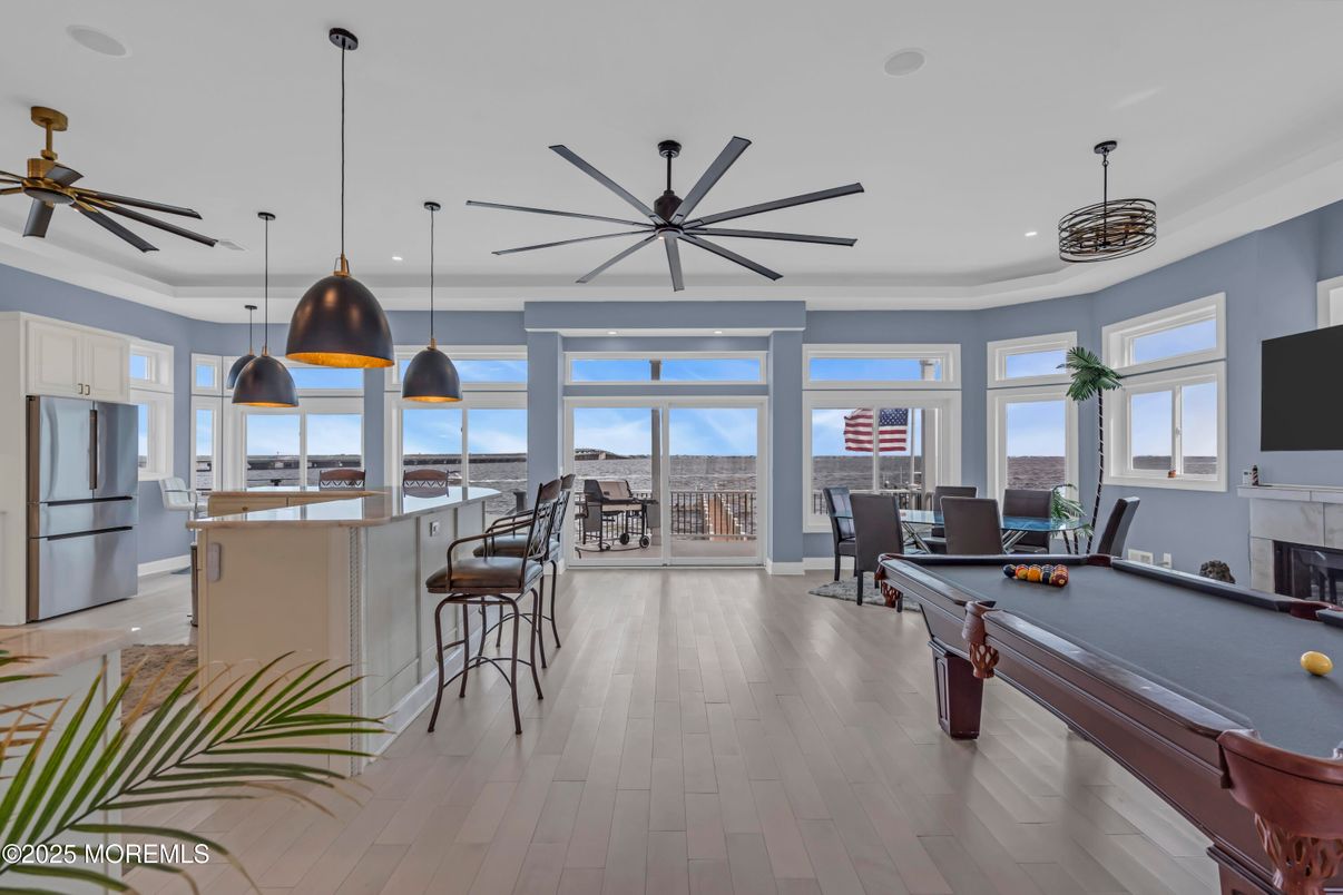 Billiard Table, Fireplace, Game Room, Interior, Kitchen, Pendant Lights, Recessed Lighting, Wood Texture Flooring